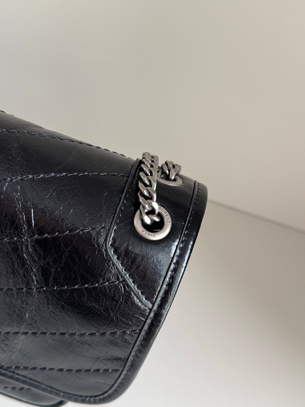 YSL dark leather shoulder bag corner clasp with linked chain and metal ring detail