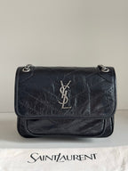 YSL dark leather shoulder bag with YSL logo on front flap and chain strap