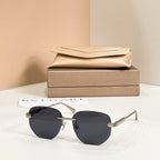 Metal aviator sunglasses, gold frame with dark navy tinted lenses