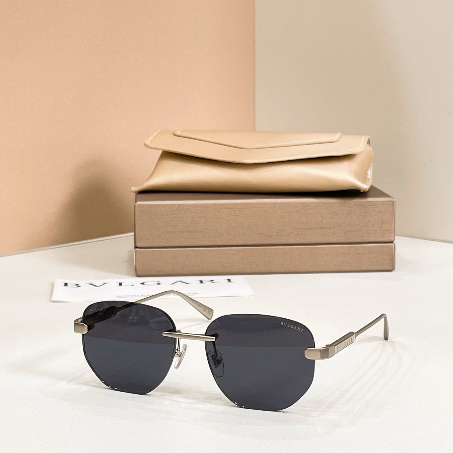Metal aviator sunglasses, gold frame with dark navy tinted lenses