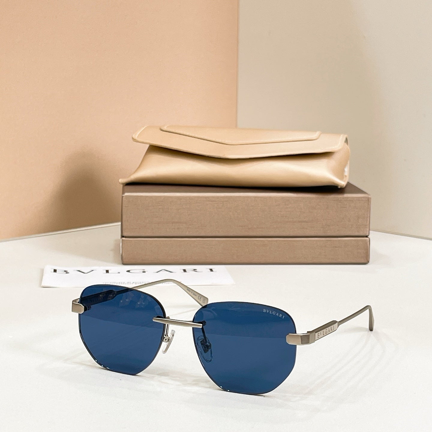 Metal aviator sunglasses, gold frame with blue tinted lenses