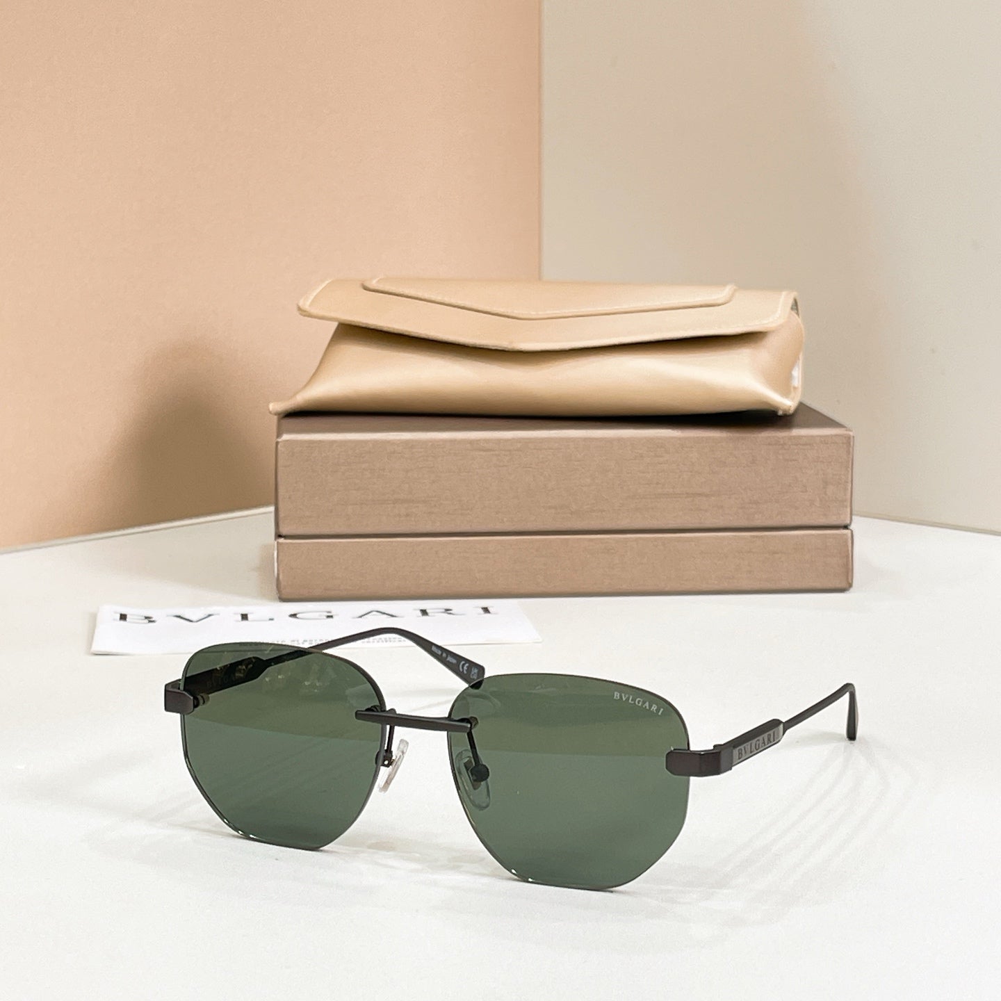 Metal aviator sunglasses, gold frame with dark green tinted lenses