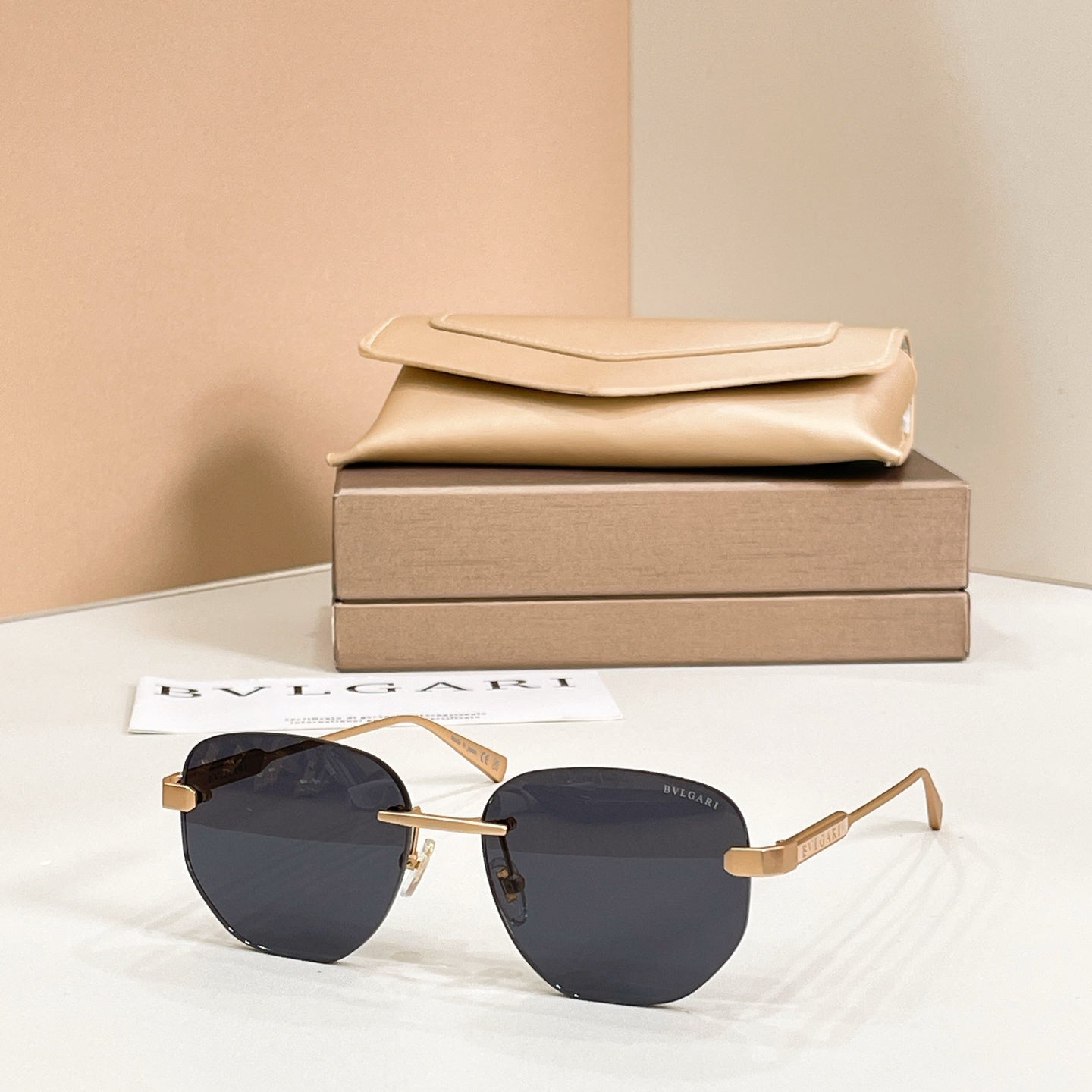 Metal aviator sunglasses, gold frame with dark tinted lenses