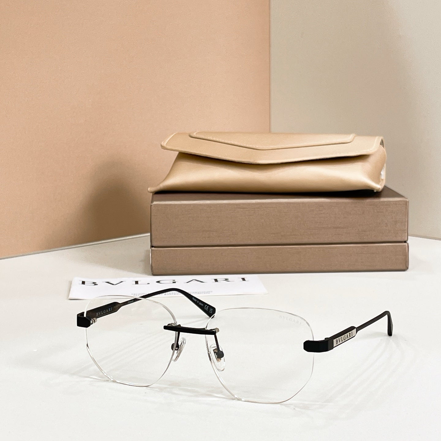 Clear eyeglasses, gold metal frame with round aviator lenses