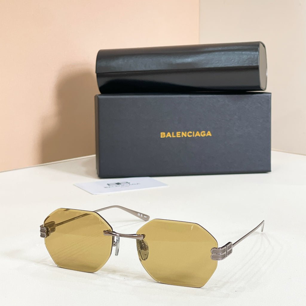 Octagonal sunglasses with gold frame and yellow lenses