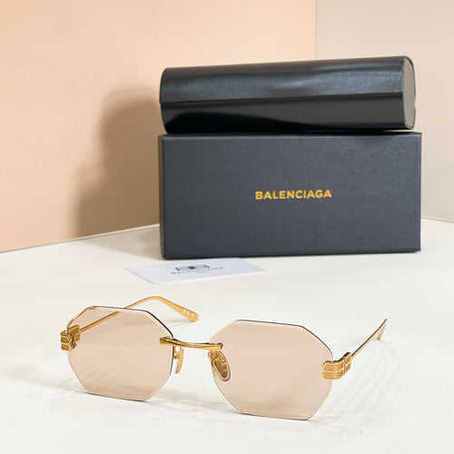 Octagonal sunglasses with gold frame and light tan lenses