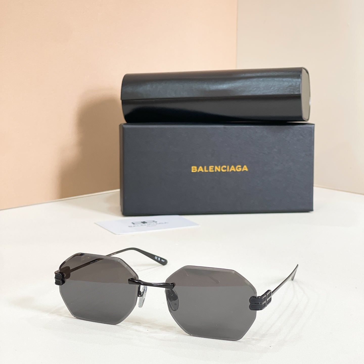 Octagonal sunglasses with dark frame and gray lenses