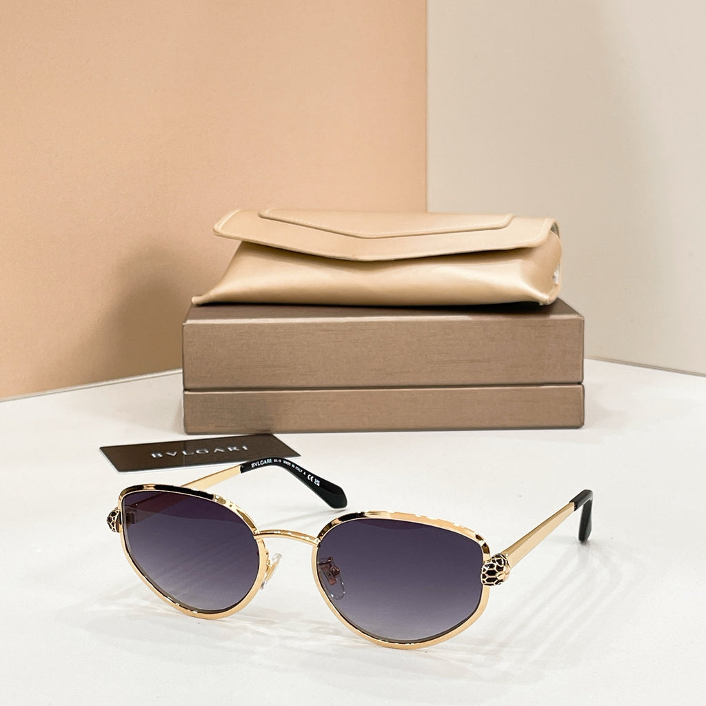 Bvlgari cat-eye sunglasses with dark purple lenses and gold-tone frame