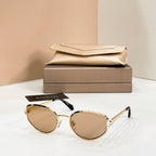 Bvlgari cat-eye sunglasses with brown-tinted lenses and gold-tone frame