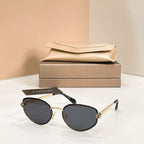 Bvlgari cat-eye sunglasses with black lenses and gold-tone frame