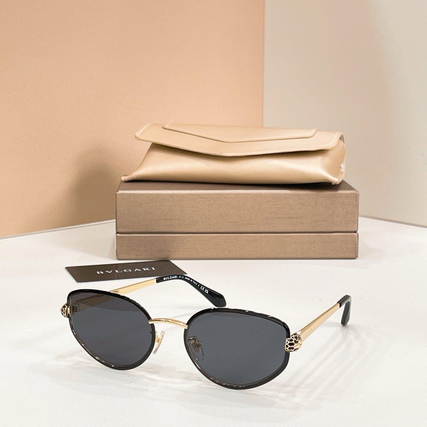 Bvlgari cat-eye sunglasses with black lenses and gold-tone frame