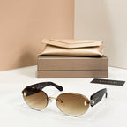 Bvlgari sunglasses with gold metal frame and dark tinted round lenses