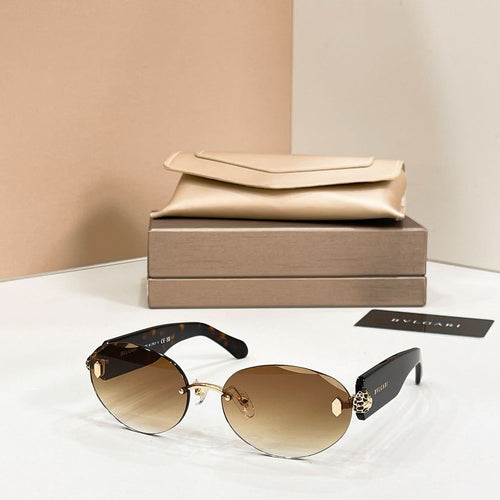 Bvlgari sunglasses with gold metal frame and dark tinted round lenses