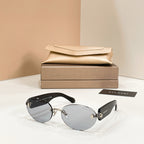 Bvlgari sunglasses with black frame and gray tinted round lenses