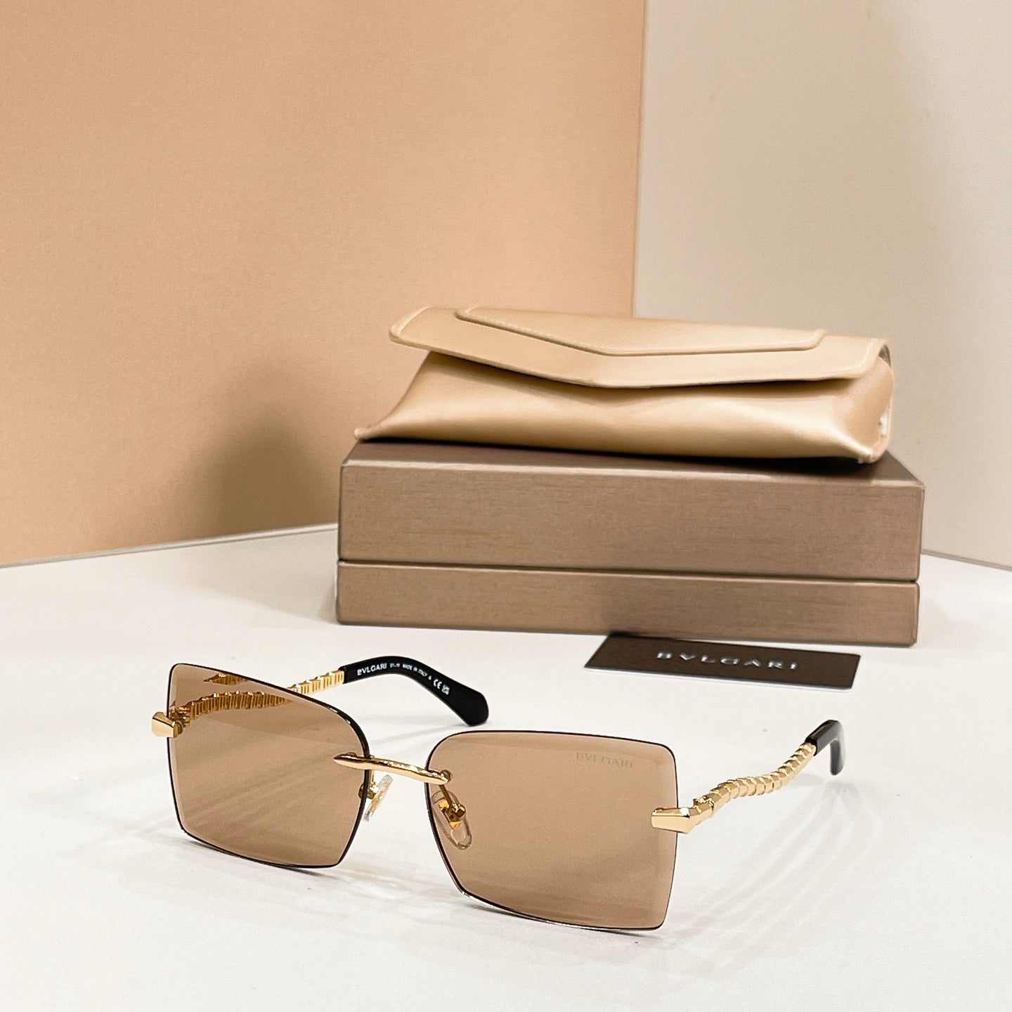 Bvlgari square sunglasses with tan frames and gold bar temples