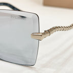 Bvlgari glasses temple close-up with braided metal chain and gold hinge