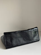 Black leather slim pouch with textured surface and top edge seam