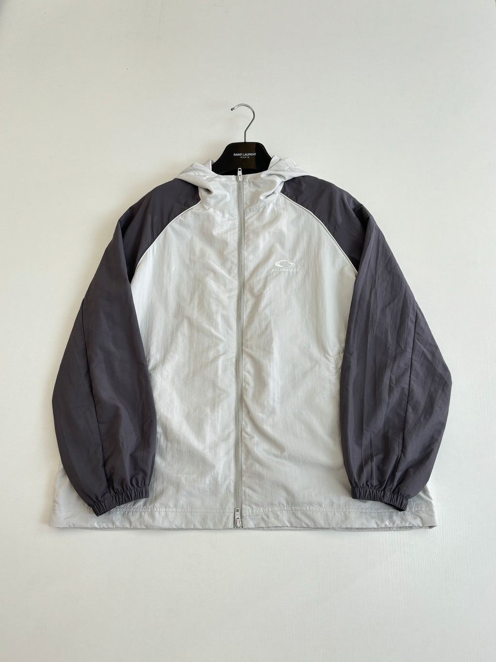 Balenciaga long jacket, white front with dark raglan sleeves and hood