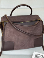 Loewe brown leather handbag with zip closure, gold-tone trim, and long crossbody strap