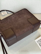 Loewe brown leather handbag with boxy shape, contrast trim panels, and top handle