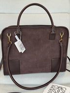 Loewe dark brown leather handbag with structured shape, top handles, and hanging tags