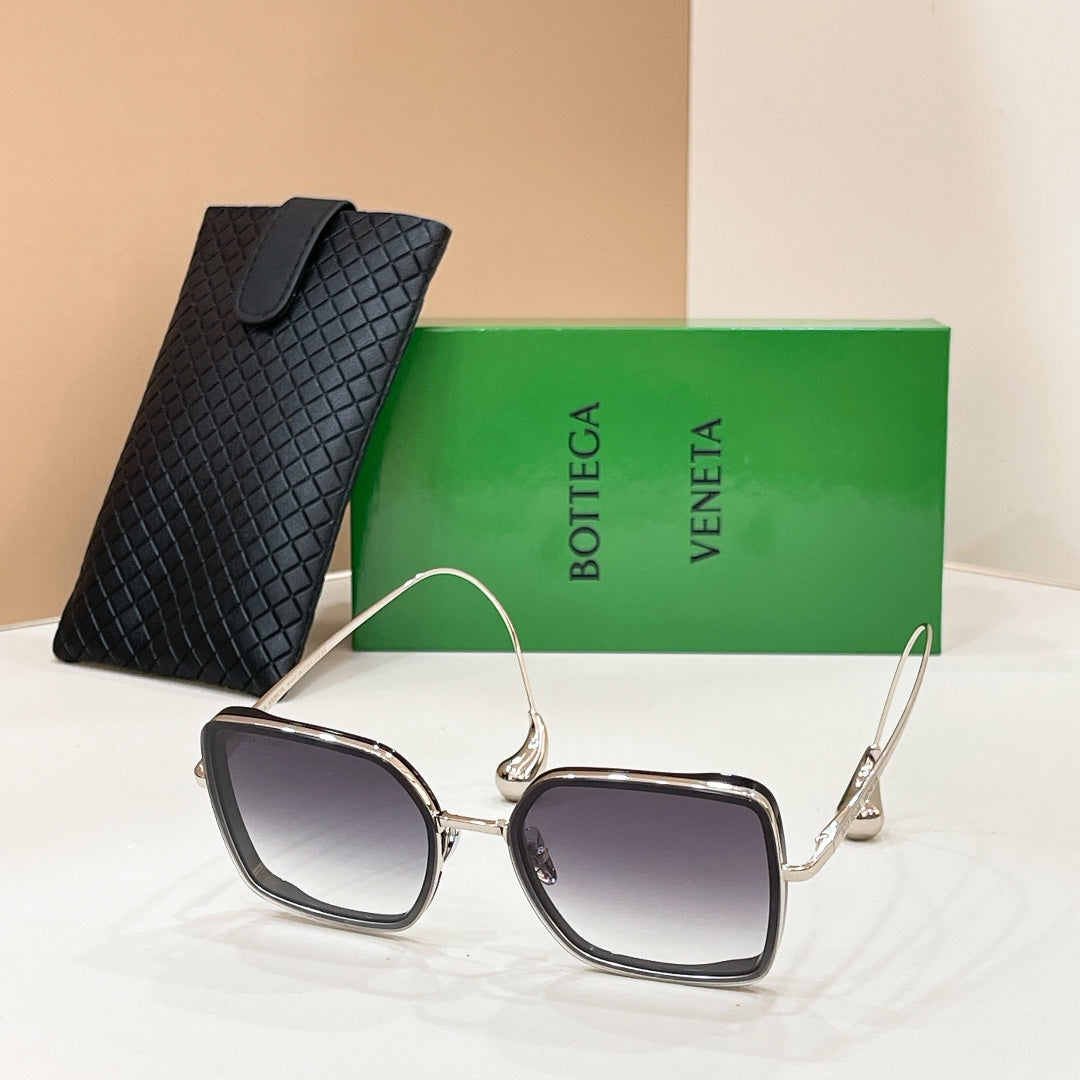 Bottega Veneta sunglasses with silver frame and dark tinted square lenses