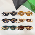Three sunglasses with dark and amber frames, beside textured black case.
