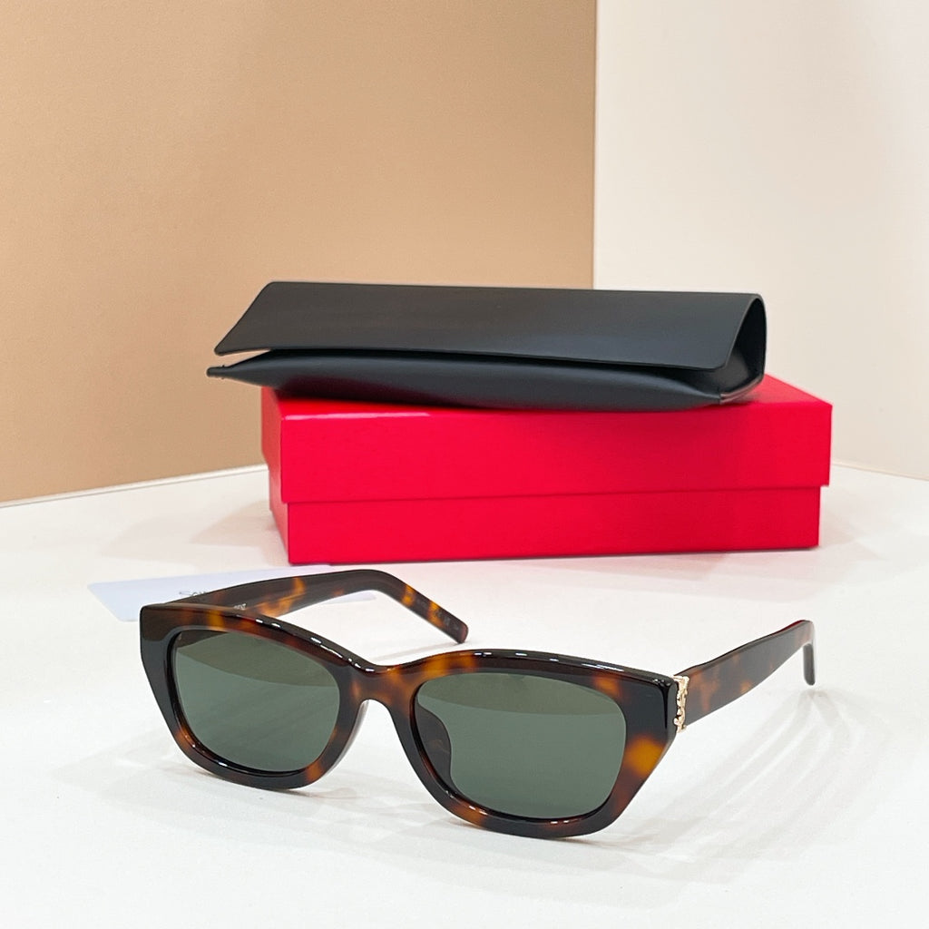 Tortoiseshell cat-eye sunglasses with dark lenses and gold-tone hinge details