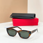 Tortoiseshell cat-eye sunglasses with dark lenses and gold-tone hinge details