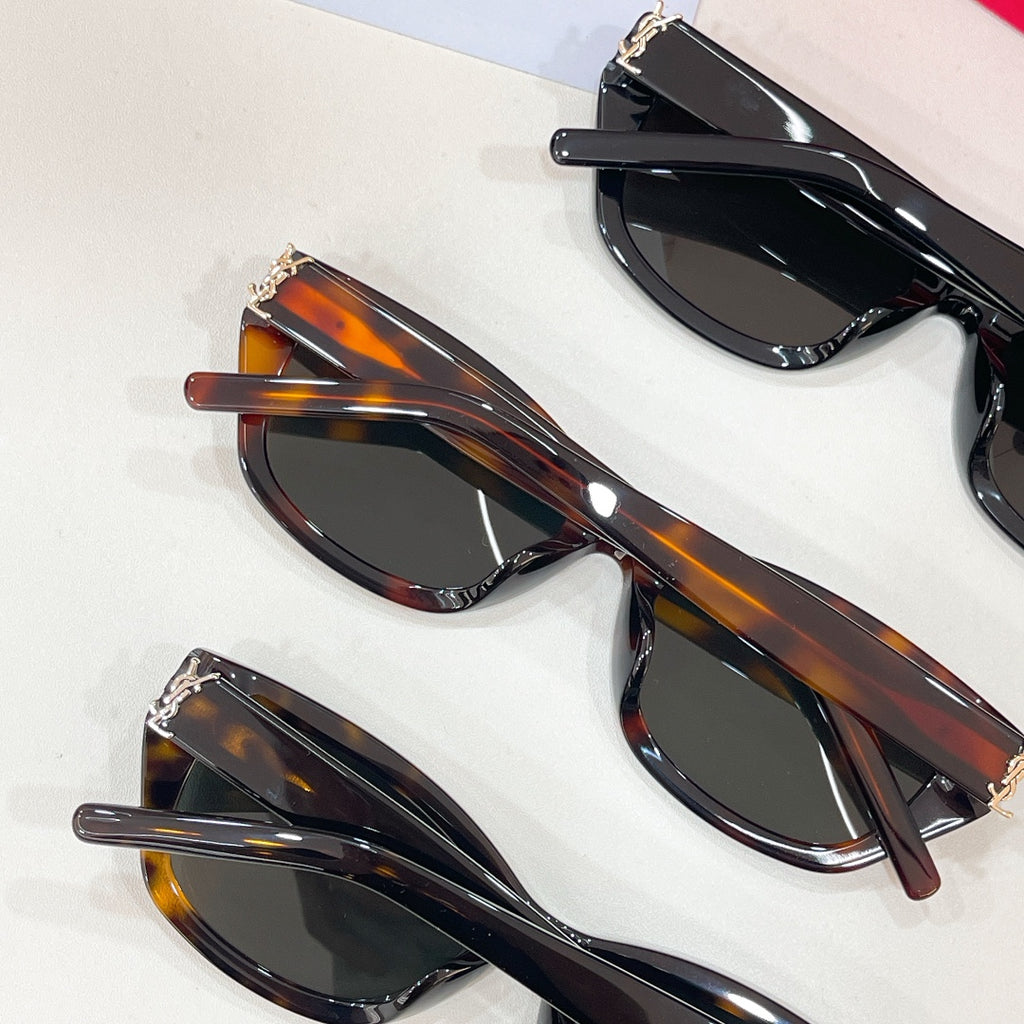 Set of cat-eye sunglasses with tortoiseshell and black frames, dark lenses