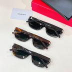 Cat-eye sunglasses set with black and tortoiseshell frames, dark lenses, metal hinges
