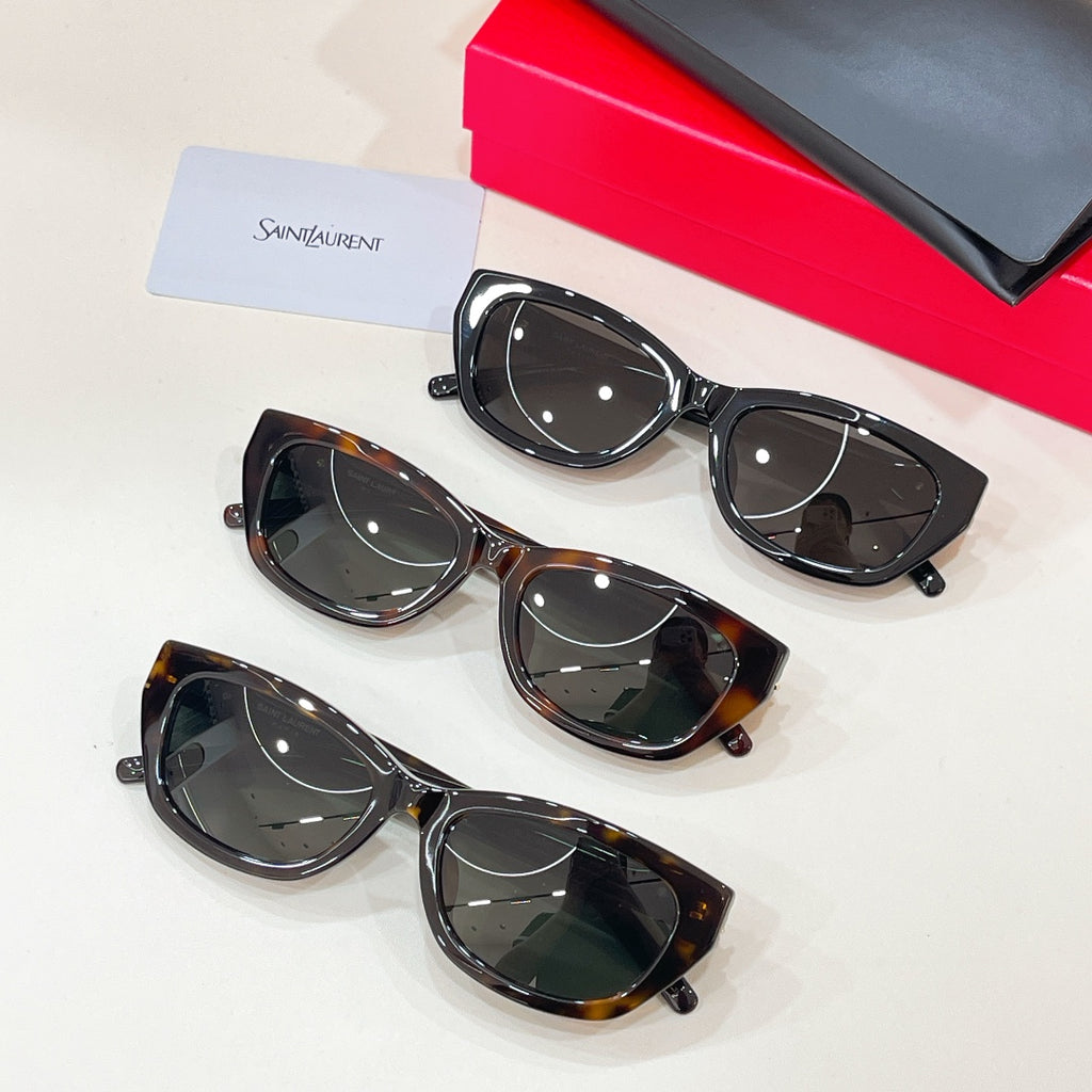 Three pairs of cat-eye sunglasses: black and tortoiseshell frames with dark lenses
