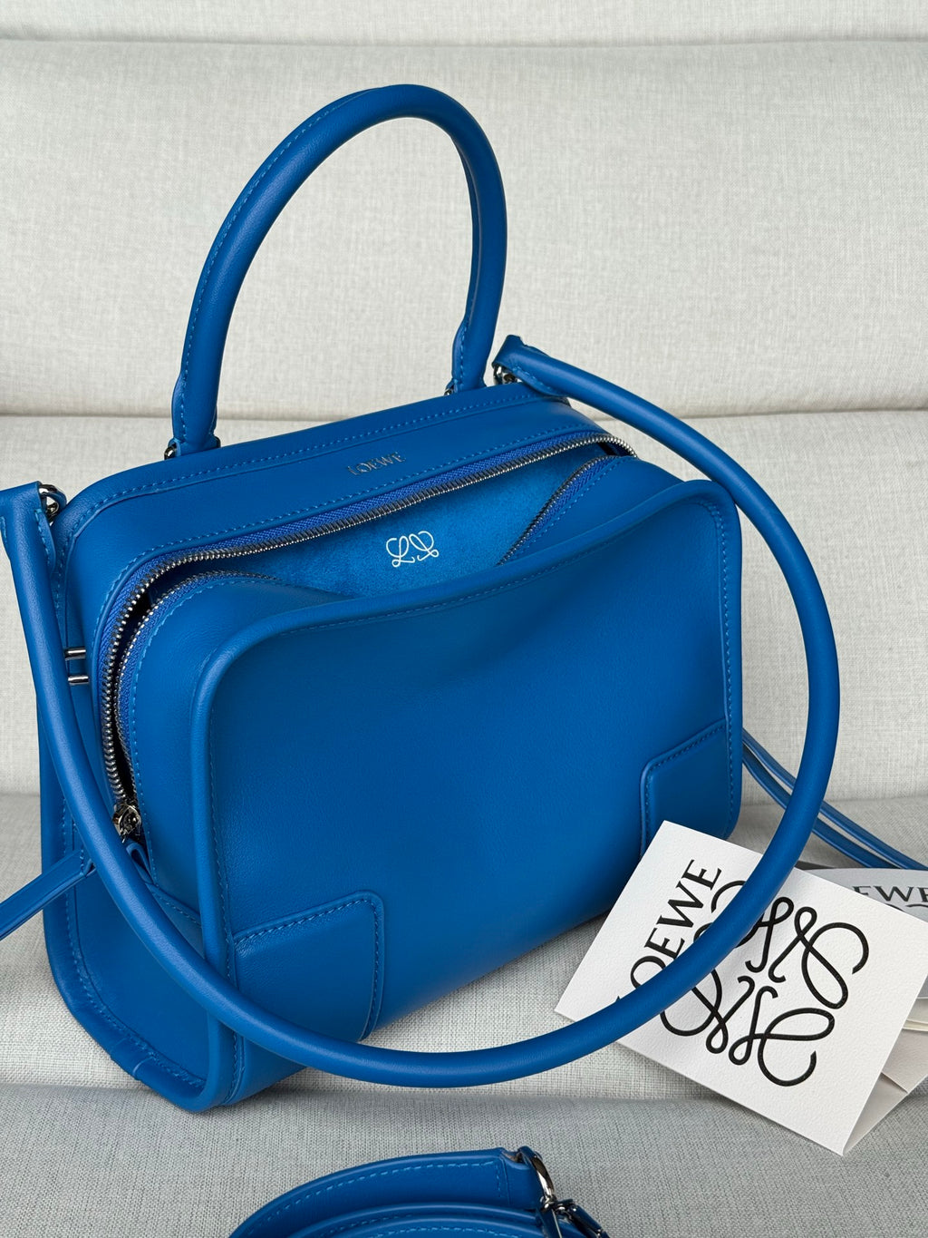 Loewe blue leather structured bag with rounded handle and crossbody strap