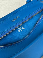Loewe blue leather bag close-up of LOEWE logo and double zip pullers