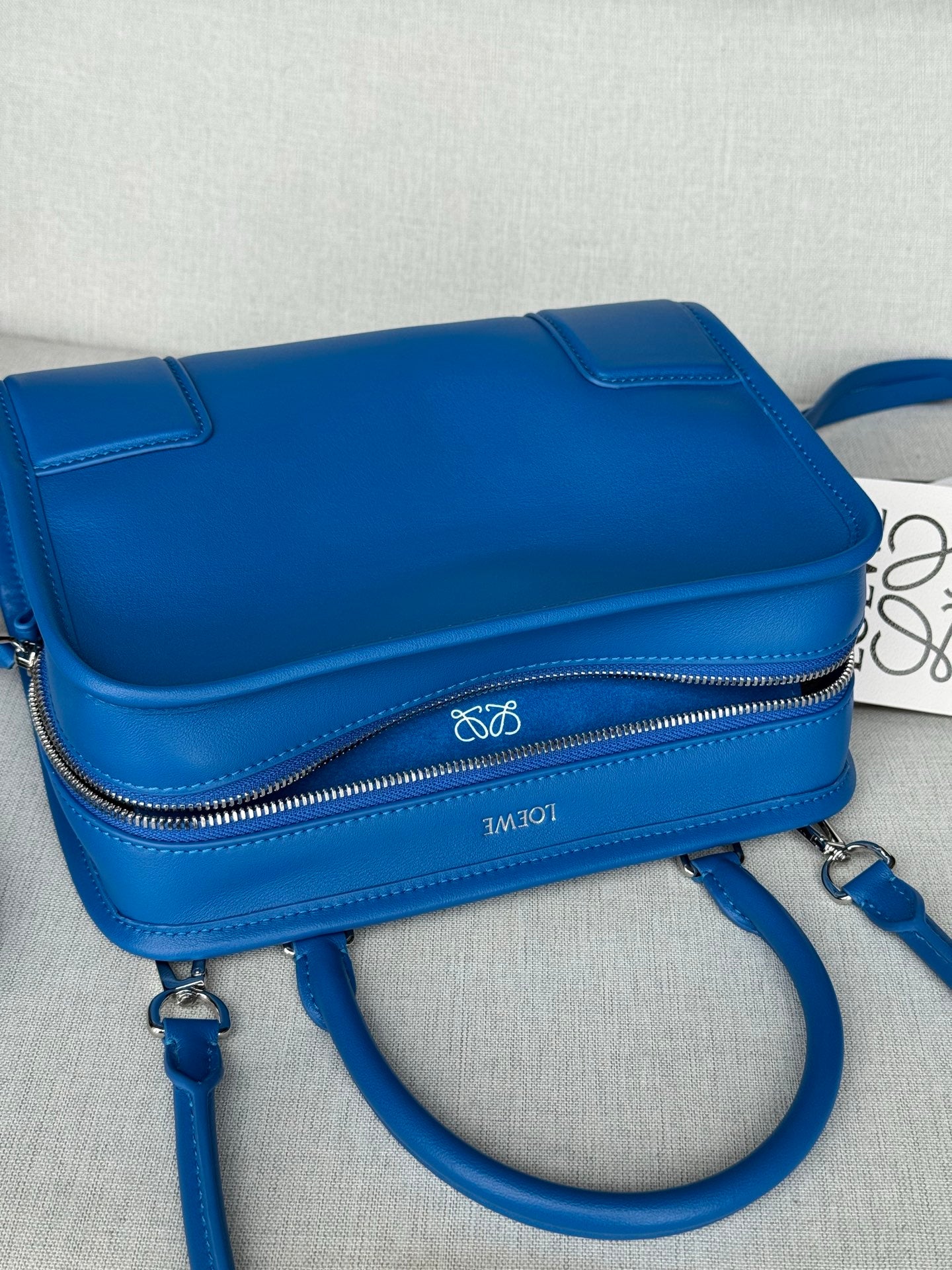 Loewe blue leather mini crossbody bag with front flap and zip pocket