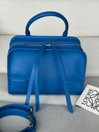 Loewe blue leather top-handle bag with front zip and long shoulder strap
