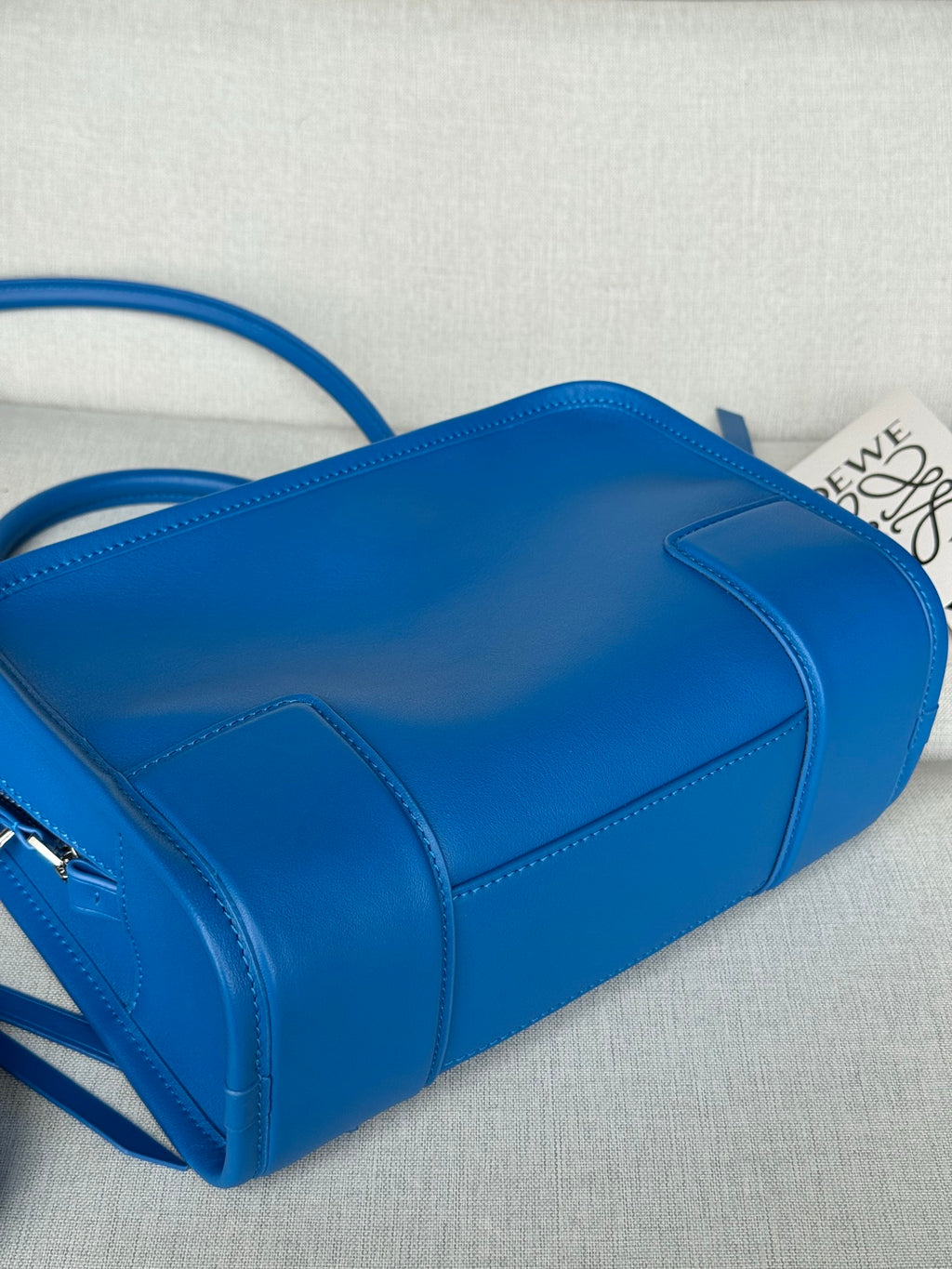 Loewe blue leather structured bag with zip top and folded corners detail