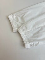 White jacket hem with ruched elastic cuffs