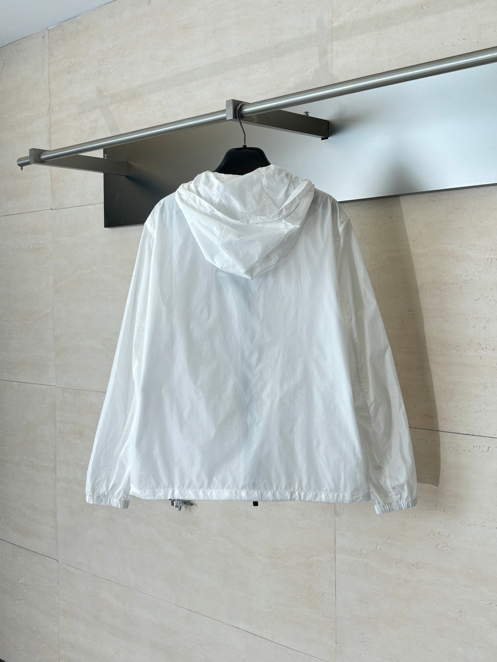 Burberry hooded jacket in white, back view with full front zipper and hood