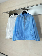Blue and white hooded zip jackets on hangers, side by side