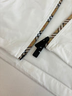 Burberry jacket close-up: black trim on inner hem and zipper tape