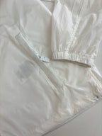 Burberry white jacket close-up: cuffs and hem with subtle seam lines