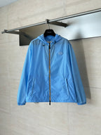 Blue hooded zip jacket with Burberry logo patch, front view