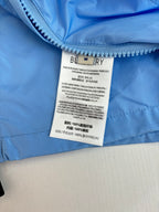 Burberry long jacket care label on light blue fabric
