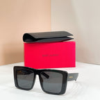 Square black sunglasses with gray mirrored lenses, YSL logo on side arms.