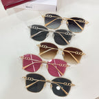 Assorted sunglasses with gold, silver, and pink frames and tinted lenses