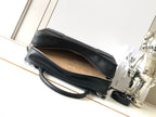 Loewe black leather bag with open top and tan lining