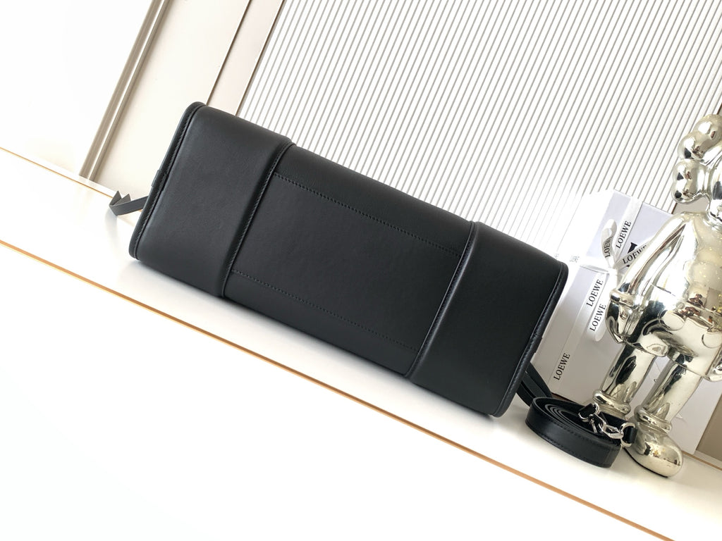 Loewe black leather long pouch bag with top strap and front seam detail