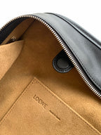 Loewe leather interior pocket with Loewe stamp and zip opening edge