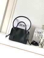 Black Loewe-branded top-handle bag with shoulder strap and gold hardware